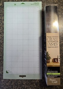 Cricut Cutting Mat 6"x12" (unused) and Raven Adhesive Backed Vinyl (unused)
