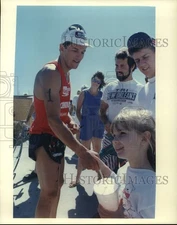 1988 Press Photo Triathlon winner Mike Pigg congratulated at South Shore Harbour