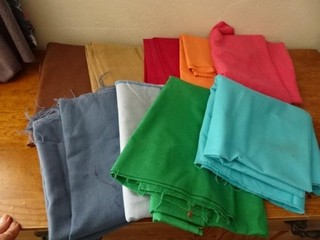 approx 12 yds cotton/cotton blend fabric pretty solids MIX brn blue red green
