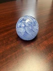 Murano filigrana paperweight featuring intricate white and light blue ribbon