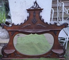 Ornate victorian mahogany framed  overmantle with bevelled mirror