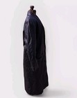 Black vintage leather trench coat with flap pockets, buttons, and shoulder pads displayed on mannequin.