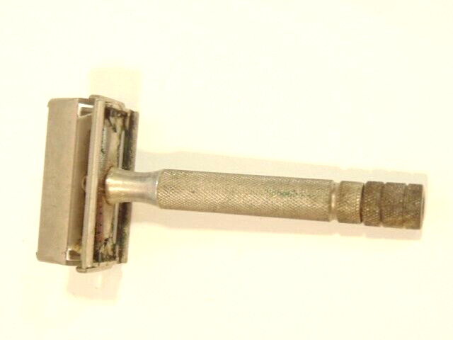 older Gillette safety razor;  marked X-4 on back of shaving head