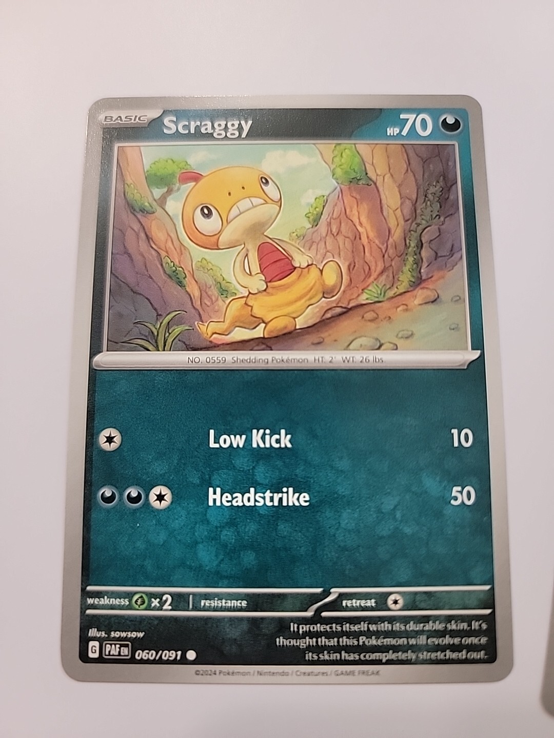 Scraggy - 060/091 Paldean Fates Pokemon - NM/MINT