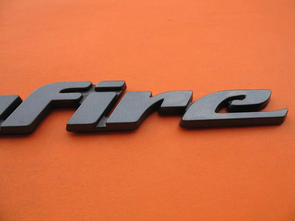 00 01 02 03 04 05 PONTIAC SUNFIRE PUERTA LATERAL EMBLEMA LOGOTIPO INSIGNIA SIGNO SÍMBOLO OEM Foto 3 de 4