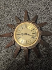 Vintage sunburst wall clock by Anstey & Wilson, made in England.