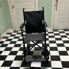 Black Foldable Transport Wheelchair, Padded Armrests, Footrests, 4-Wheel