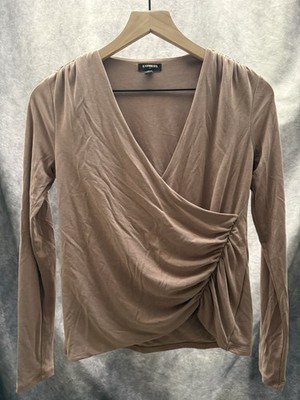 Beige Express brand long-sleeve wrap top featuring ruched side detail.