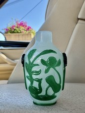 Chinese Peking Glass Green Overlay Snuff Bottle with Stylized flowers