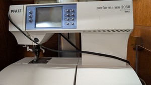 Pfaff Performance 2058 sewing machine in wooden cabinet
