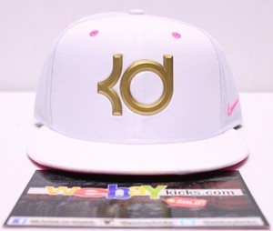 white and gold nike hat