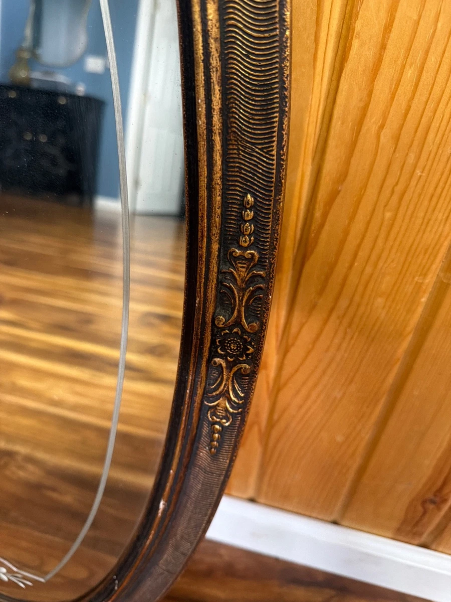 Antique etched oval mirror with decorative ornate on frame