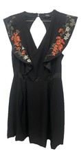 ABS Boho Little Black Dress with Floral Embroidery and a satin waistband.