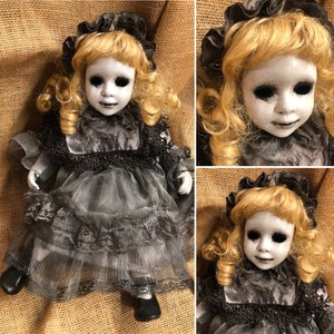 creepy blonde doll