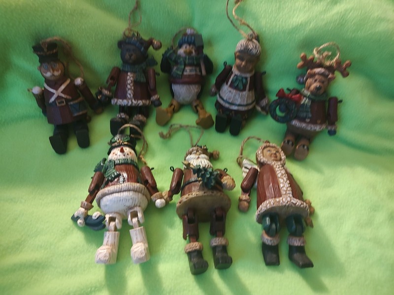 5.5 in Polyresin  looks like wood. Arms and Legs Move. Qty Of 8 Different Ones