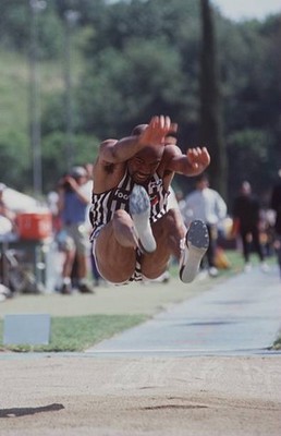 Mike Powell in action on his way to winning the mens long jump com- Old Photo