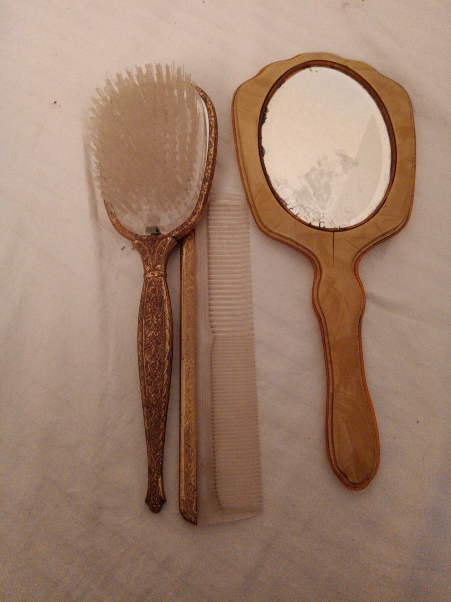 Vintage Bakelite Celluloid mirror, Gold in color brush and 
