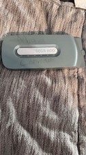 Microsoft Xbox 360 hard drive 60gb with some writing on the shell