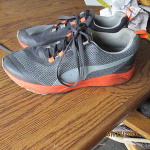 grey and orange puma shoes