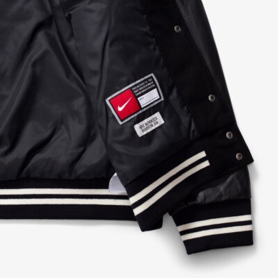 $500 Men's Size M NIKE AUTHENTICS MEN'S VARSITY JACKET