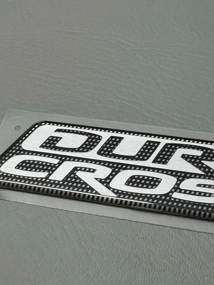 Mitsubishi Raider Duro 2006-2009 emblema de puerta lateral cruzada logotipo insignia usado fabricante original Foto 3 de 4