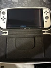Nitendo Switch OLED with Carry Case And Pokémon Lets Go