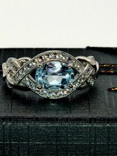 Sterling Silver Blue Topaz Ring With White Topaz Accents Infinity Braid Unique