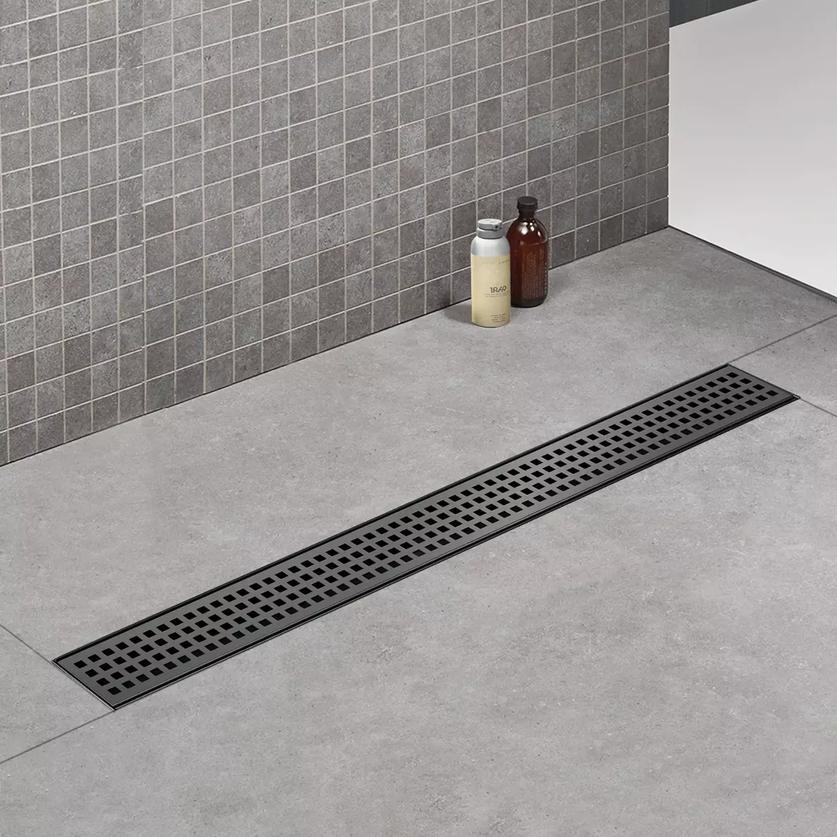 Black 24 inch Linear Shower Drain with Square Hole Grill Panel and hair stranier
