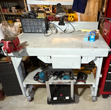 Gray Work Bench Workbench Table with Drawer and Wheels. Workbench is on casters.