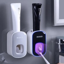 Automatic toothpaste dispenser toothbrush holder