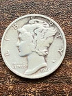 1944 s silver mercury dime a very fine coin . pluses a surprise