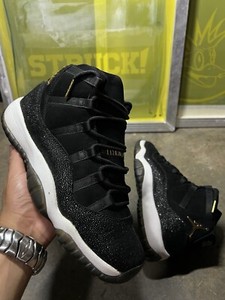 black and gold jordan 11 heiress