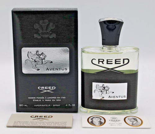 Creed Aventus 120ml bottle with black cap, black box, and two oval portraits of historical figures.