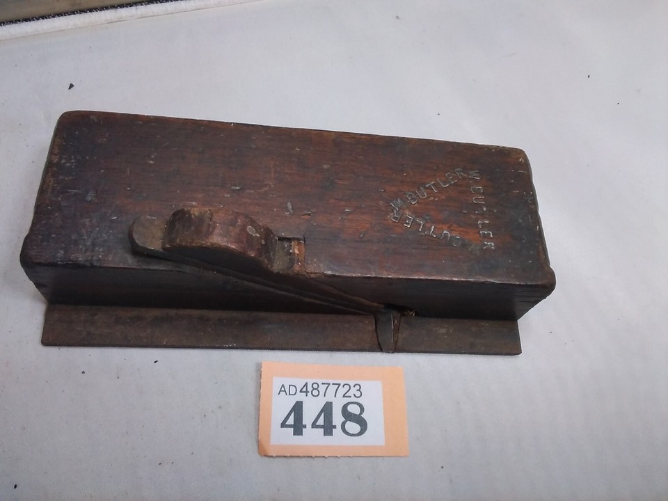 A vintage woodworking hand plane — a beautifully tactile old tool that woodworkers actually still use and collectors love to display.