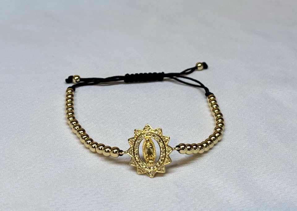 Pulsera unisex oro laminado 18k con dije religioso floral elegante Foto 2 de 4