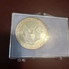 an American Silver Eagle bullion coin, featuring the Heraldic Eagle design.