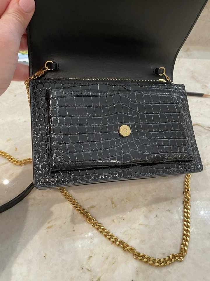 Bolso de hombro Yves Saint Laurent cocodrilo negro con detalles dorados Foto 3 de 4