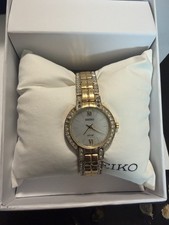 Seiko Solar SUP200 White Dial Gold Tone SS Crystal Accented Ladies Watch