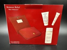 CLARINS 4pc Skin Softness Moisture Relief - Hand Nail - Lip - Body Lotion Bag