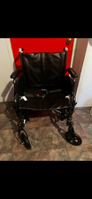 Brand New Wheelchair, with leg rests and back/seat cushions.