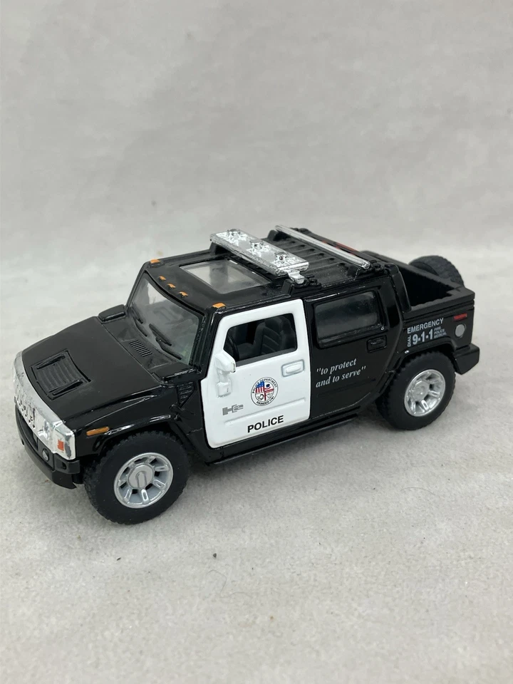 Veículo policial Hummer H2 SUT fundido 2005 escala 1:40 Kinsmart - Imagem 4 de 4