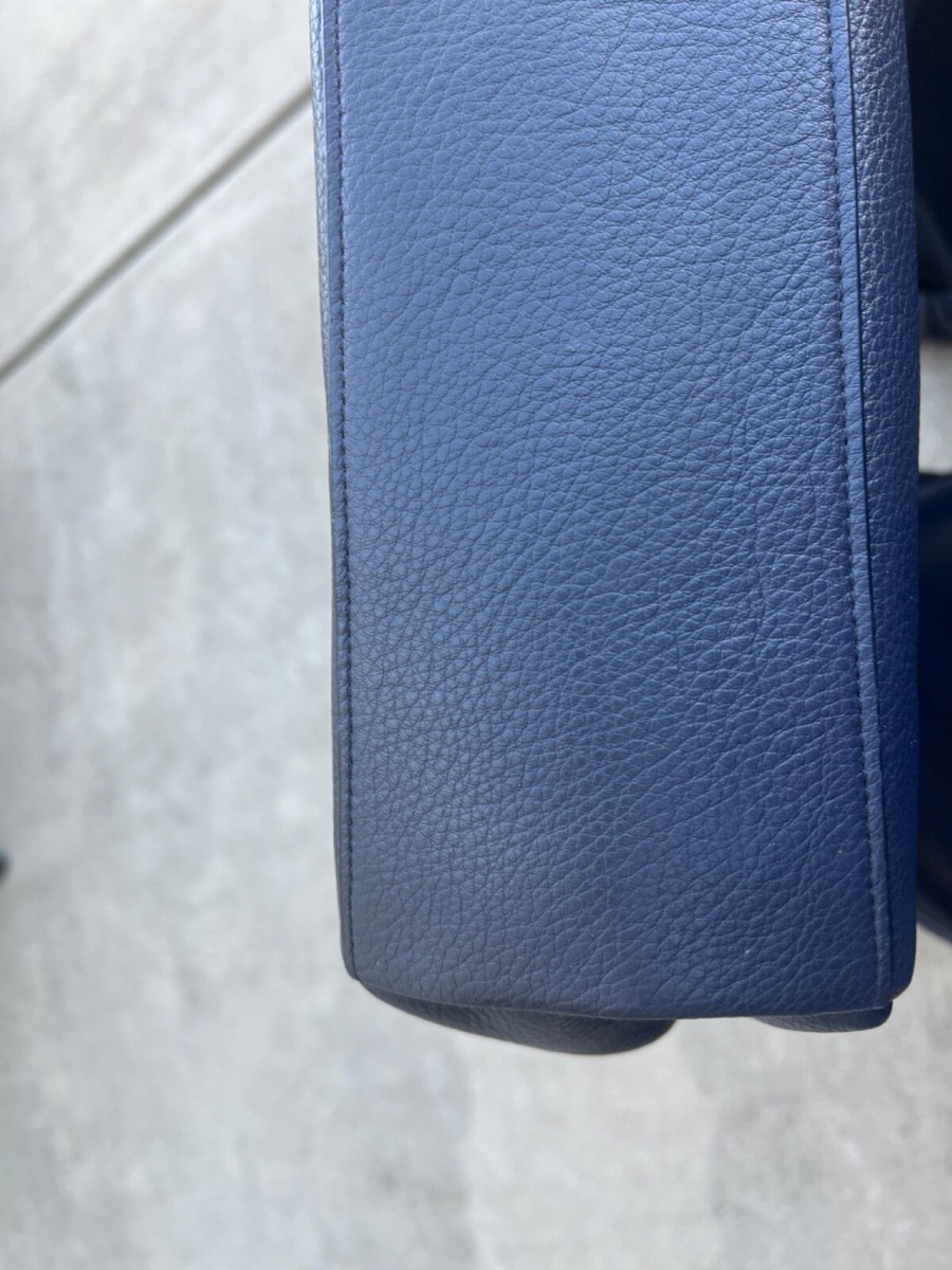 Gently used Coach navy blue leather handbag