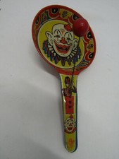 A VINTAGE METAL TIN CLOWN U.S. TOY CLAPPER NOISE MAKER HALLOWEEN DECORATION