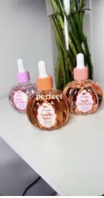 amberglow Hydrating Body Oil 3-Pack 100 mL Vanilla Spice, Peony & Amber, Apple