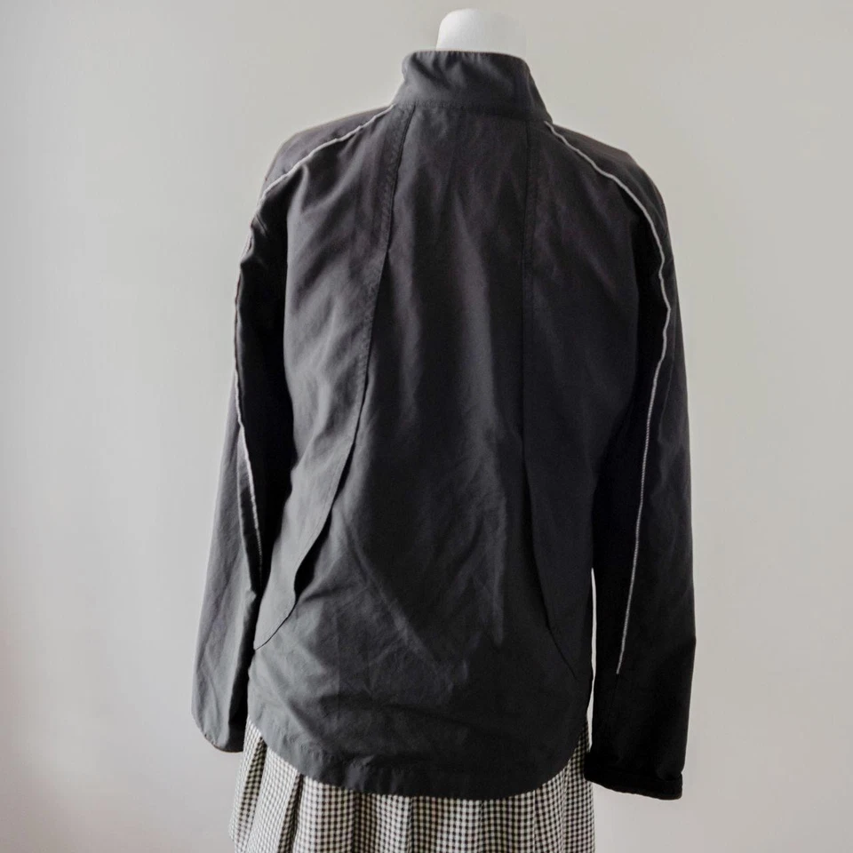 Chaqueta para correr negra New Balance entrenamiento ligero atlética manga larga cremallera para mujer Foto 4 de 4