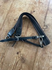 Chest strap to secure saddle and reduce slip