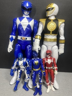 Four Power Rangers Action Figures Large And Small, White, Blue, Red