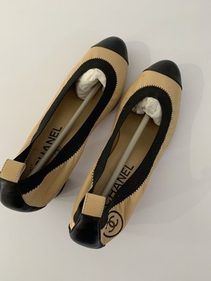Designer Fashion   CHANEL Cream and black timeless shoes