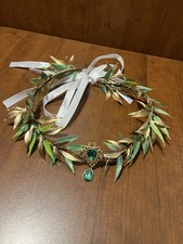 This headband features lush green and gold leaves Unisex One Size Fits Most