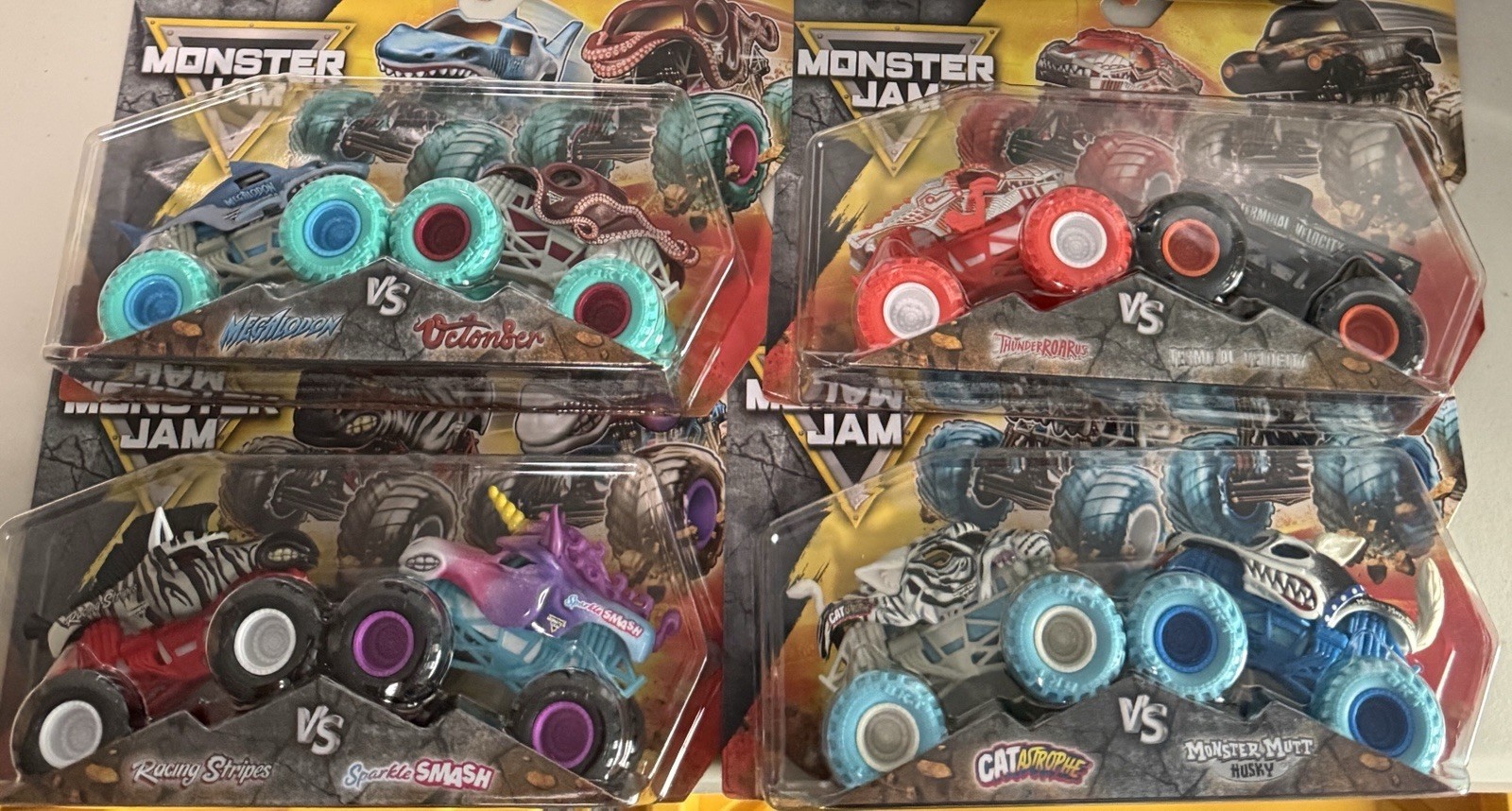 Monster Jam Series 25 VS 2 Truck Set Complete Lot by Spin Master 1/64 scale